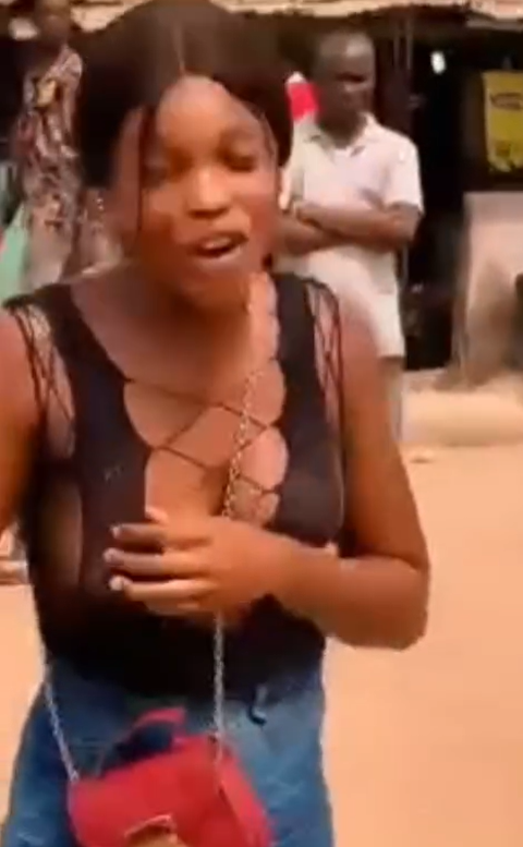 Lady harassed by some young men over outfit she wore to a bus park (video)