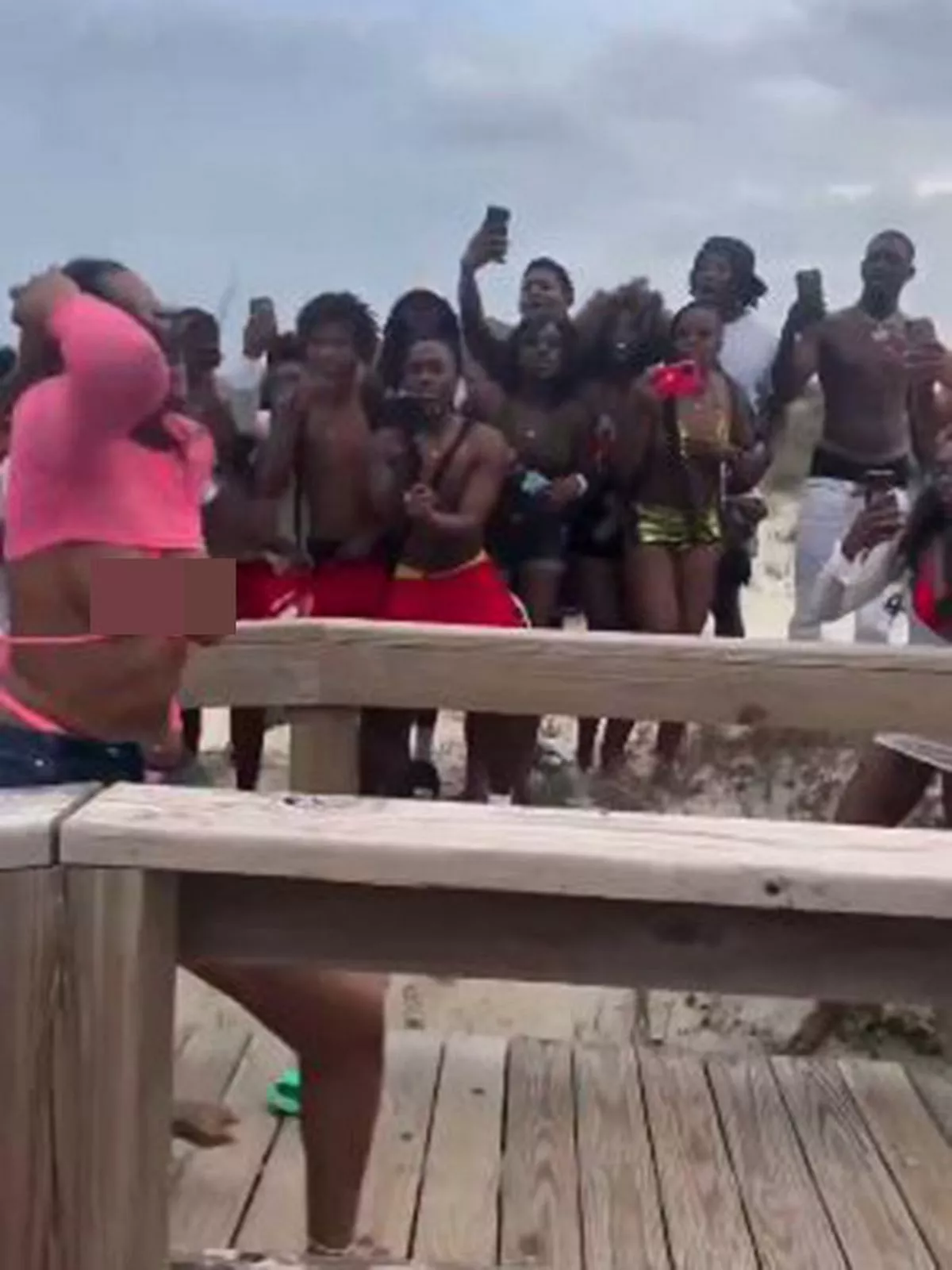 Breasts fall out of bikinis as women fight during spring break outing (photos/video)